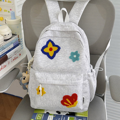 Blumenbestickter Schulrucksack