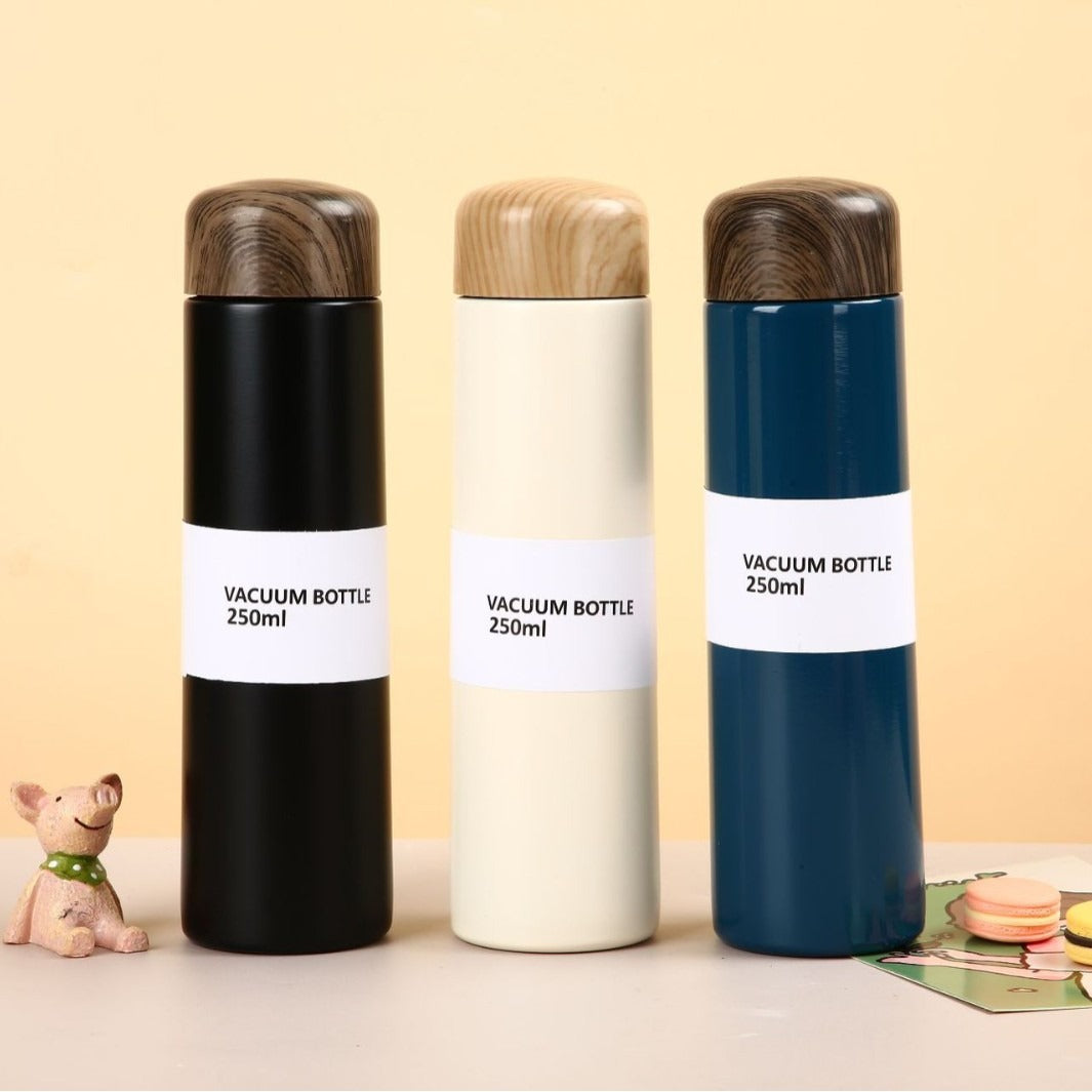 Damen vakuumisolierte Wasserflasche mit innovativem Holzdeckel Brehn