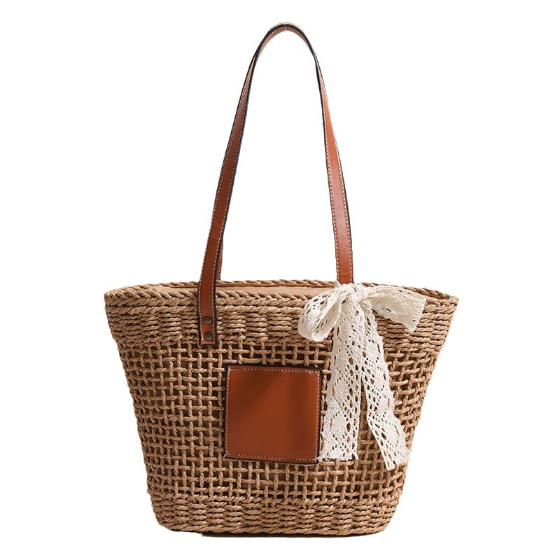 Damen Korbtasche mit eleganten Lederdetails und verspieltem Schleifenakzent Brehn