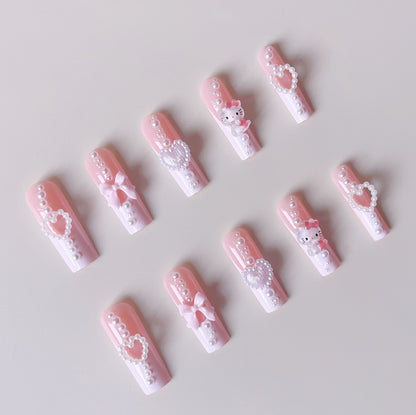 Kunstnagelset mit verspielten 3D-Pflege- und Perlenverzierungen Brehn