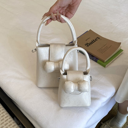 Bogen-verziertes Mini-Handtasche