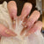 Elegantes Stiletto Press-On Nagelset mit floralem und glitzerndem Design Brehn