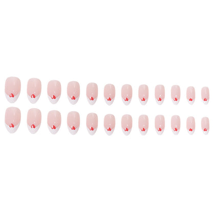 Herzgeschmücktes French Tip Nagelset Brehn