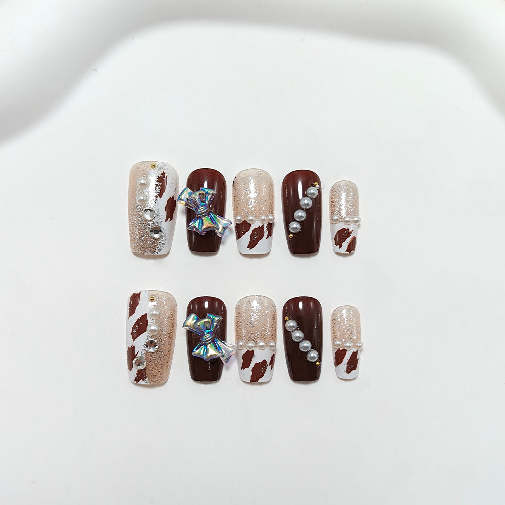 Kunstnägel mit Glamourösem Strass- und Schleifen-Design Brehn