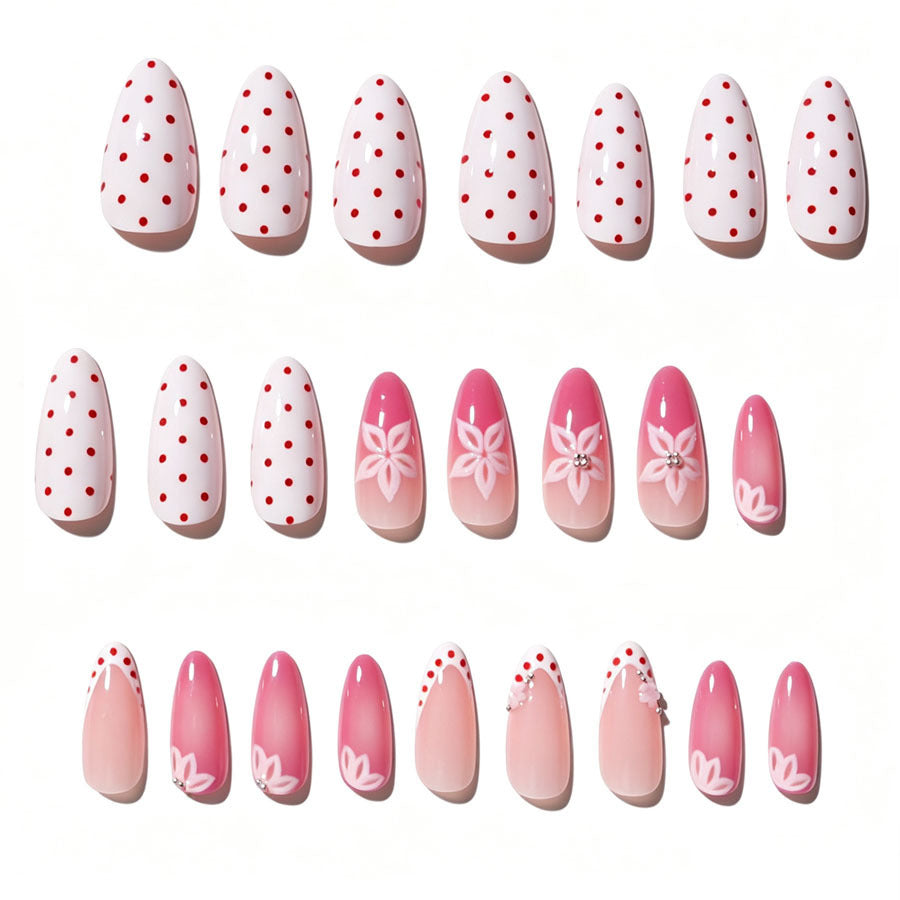 Kunstnagelset mit floralen Akzenten und charmanten Polka-Dots Brehn