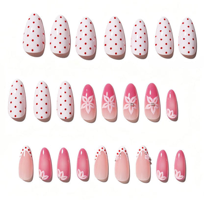 Kunstnagelset mit floralen Akzenten und charmanten Polka-Dots Brehn