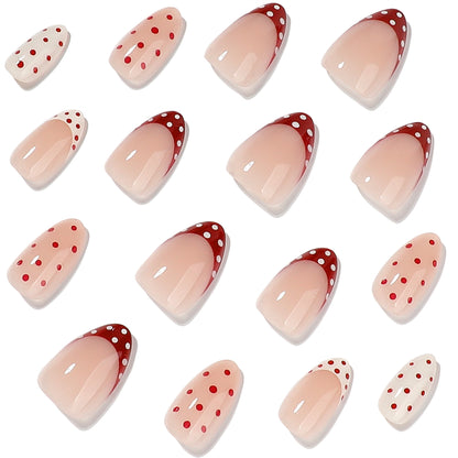 Kunstvolle Stiletto-Nägel mit niedlichen Punkten und akzentuierten Farbverläufen Brehn