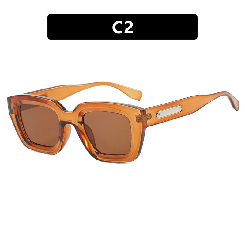 Damen quadratische Sonnenbrille mit transparentem Rahmen und braunen Gläsern Brehn