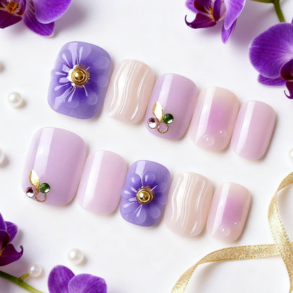 Elegantes dekoratives Press-On-Nagelset mit floralen und Juwelenakzenten Brehn