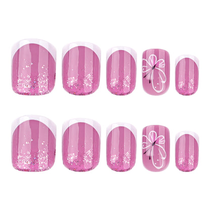 Kunstvolle Nagelkunst mit Glitzer und Schmetterlingsdesign Brehn