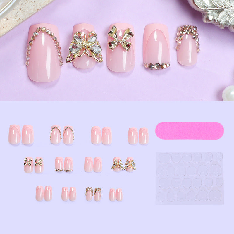 Glamouröses Kunstnagelset mit floralen Akzenten und Glitzerverzierungen Brehn