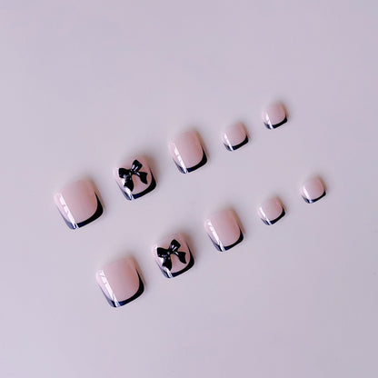 Kunstnagelset mit eleganten Schleifenakzenten Brehn