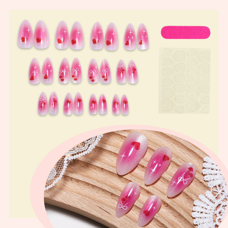 Charmante Acryl Press-On Nägel Set mit Herz- und Schleifenmotiven Brehn