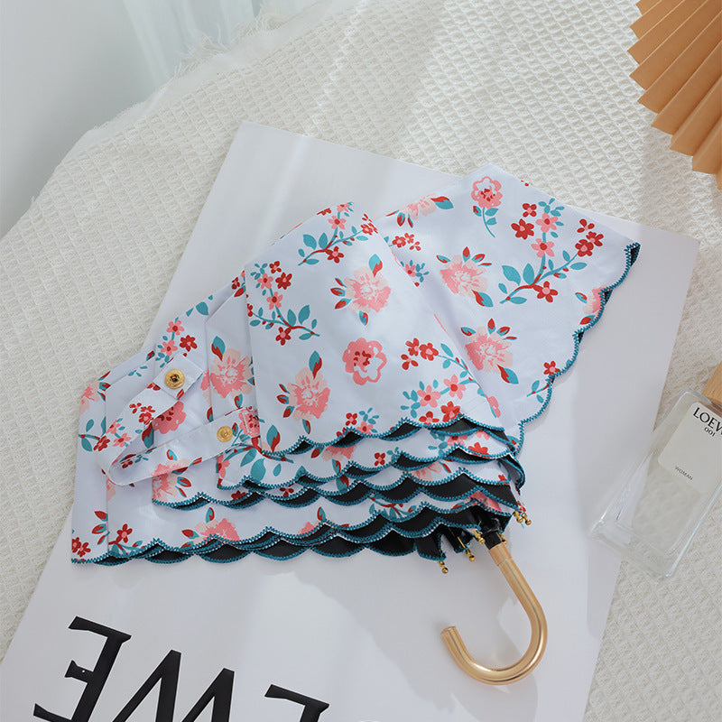 Damen eleganter Automatischer Faltregenschirm mit floralen Details Brehn