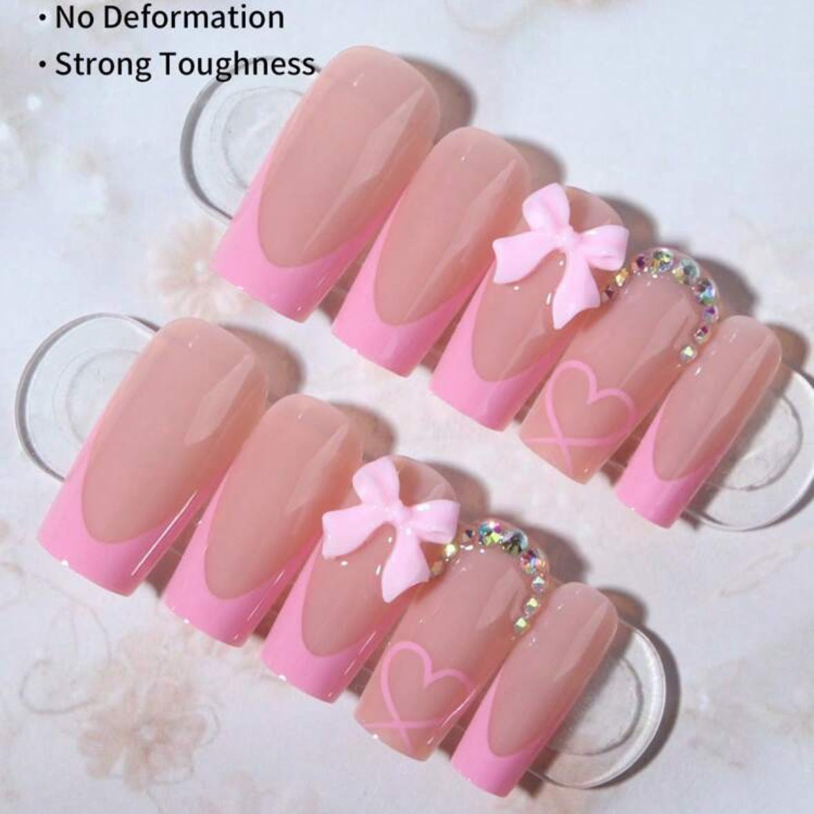 Kunstnagelset mit romantischen Schleifen- und Herzmotiven Brehn