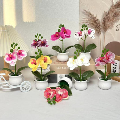 Elegante künstliche Orchideenpflanzenanordnung für die Wohnkultur-Darstellung