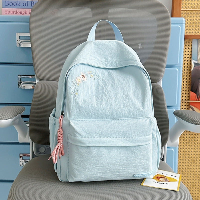 Blumenbestickter Schulrucksack