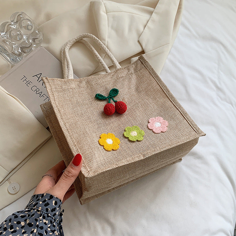 Dekorativer floraler Akzent Handtasche
