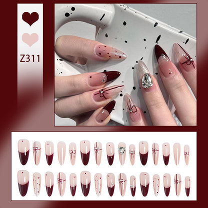 Kunstnagelset mit eleganten Schleifen- und Glitzer-Details Brehn