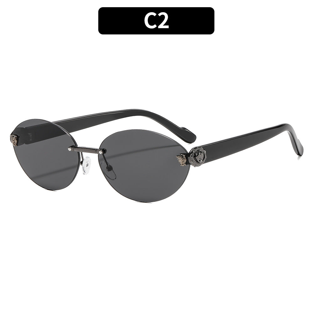 Vintage ovale Sonnenbrille mit goldenen Akzenten