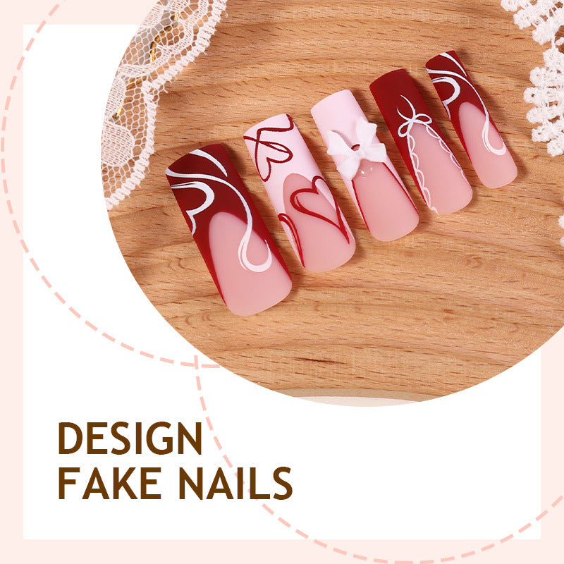 kunstvolles Nagelset mit Herz- und Schleifenmotiven Brehn