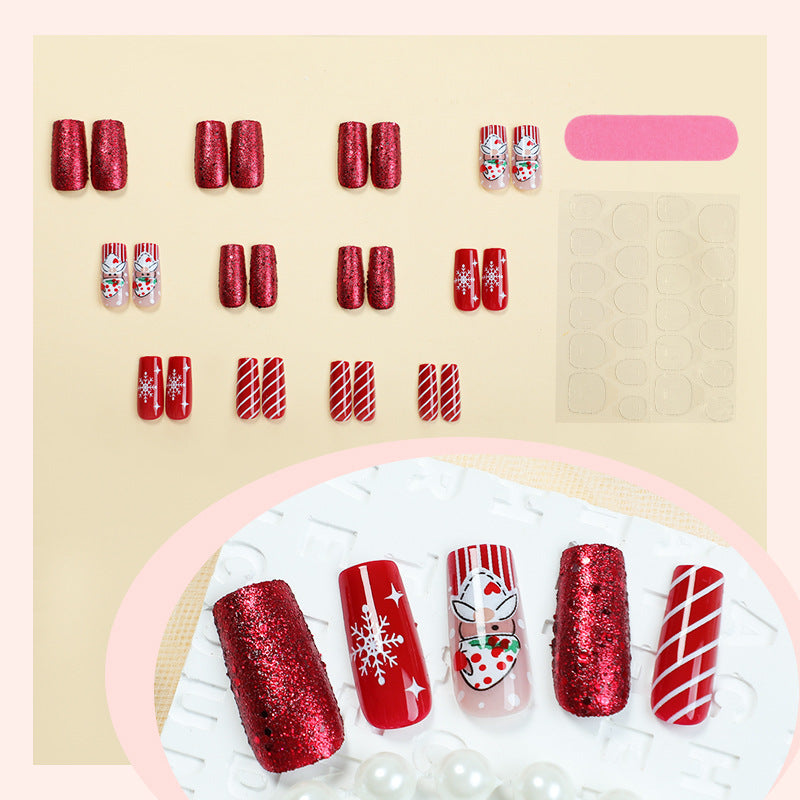 Kunstnagelset mit festlichen Weihnachtsmotiven und Glitzer Brehn