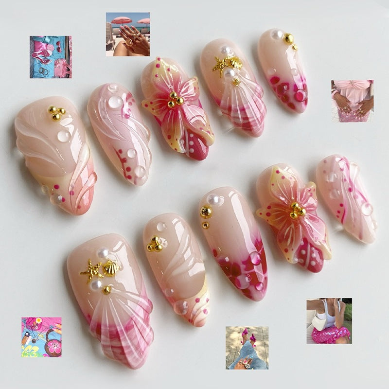 Kreatives Kunstnagelset mit romantischen Blütenmuster und funkelnden Akzenten Brehn
