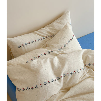 Baumwoll-Gauze Bettbezug-Set mit zarter Bordürenstickerei und melierter Nepsstruktur