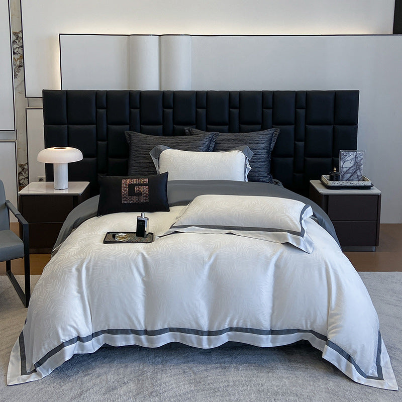 Premium-Bettwäscheset aus Baumwollsatin mit dezentem Blattmuster und feiner Kederkante