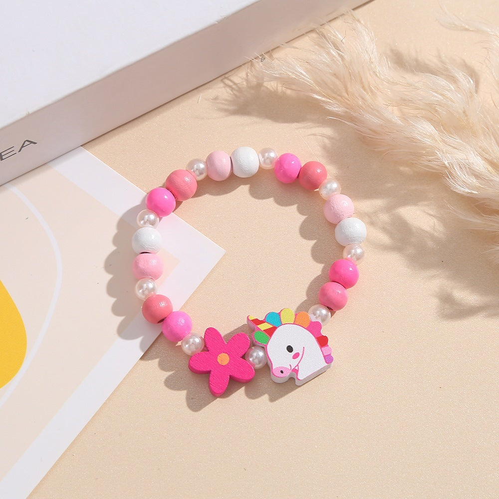 Verspieltes Kinderarmband mit Einhorn- und Blumenmotiv Brehn