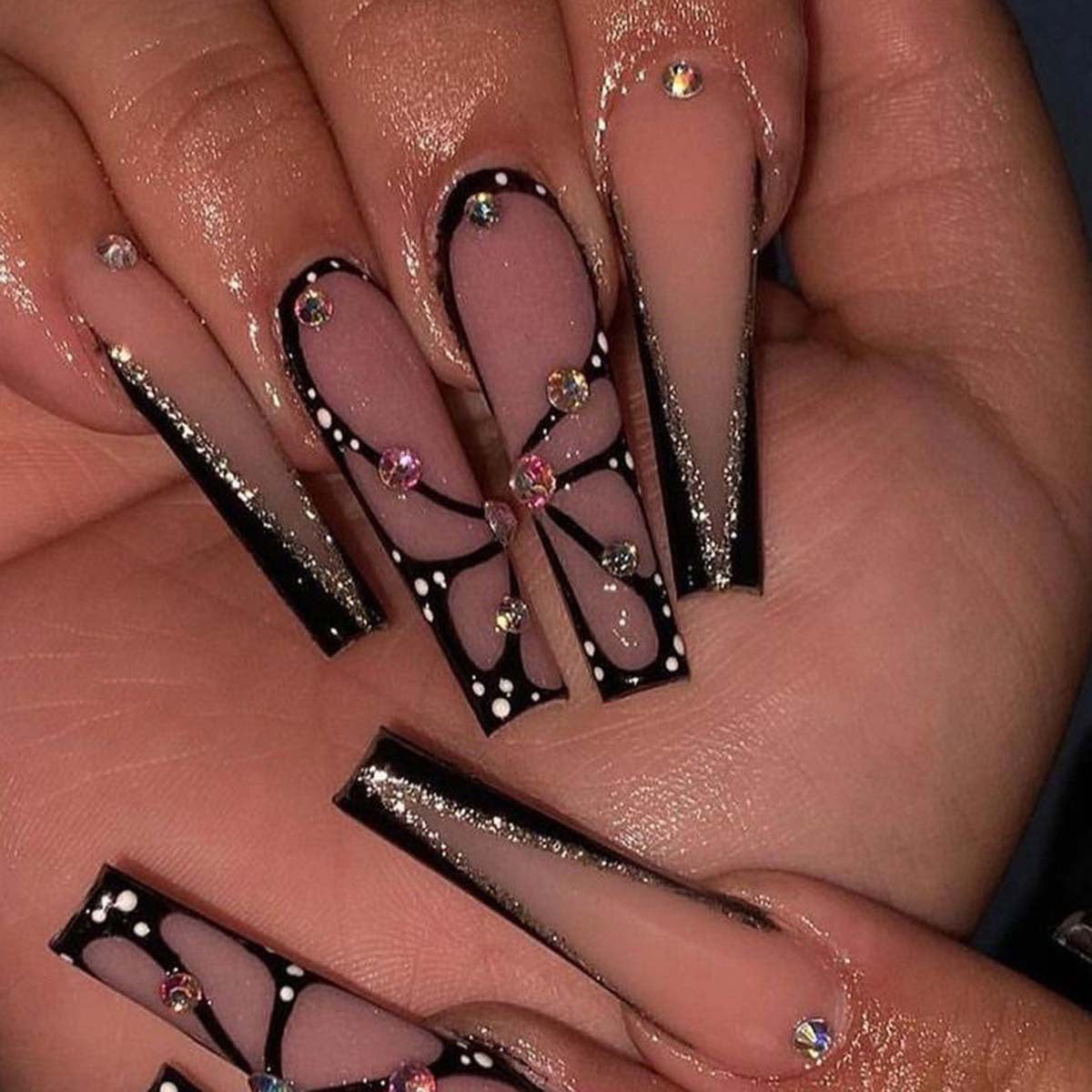 Kunstvolle Stiletto Kunstnägel mit Glitzer- und Schmetterlings-Motiv Brehn