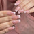 Kunstnagelset mit eleganten 3D-Blüten und glamourösen Strassakzenten Brehn