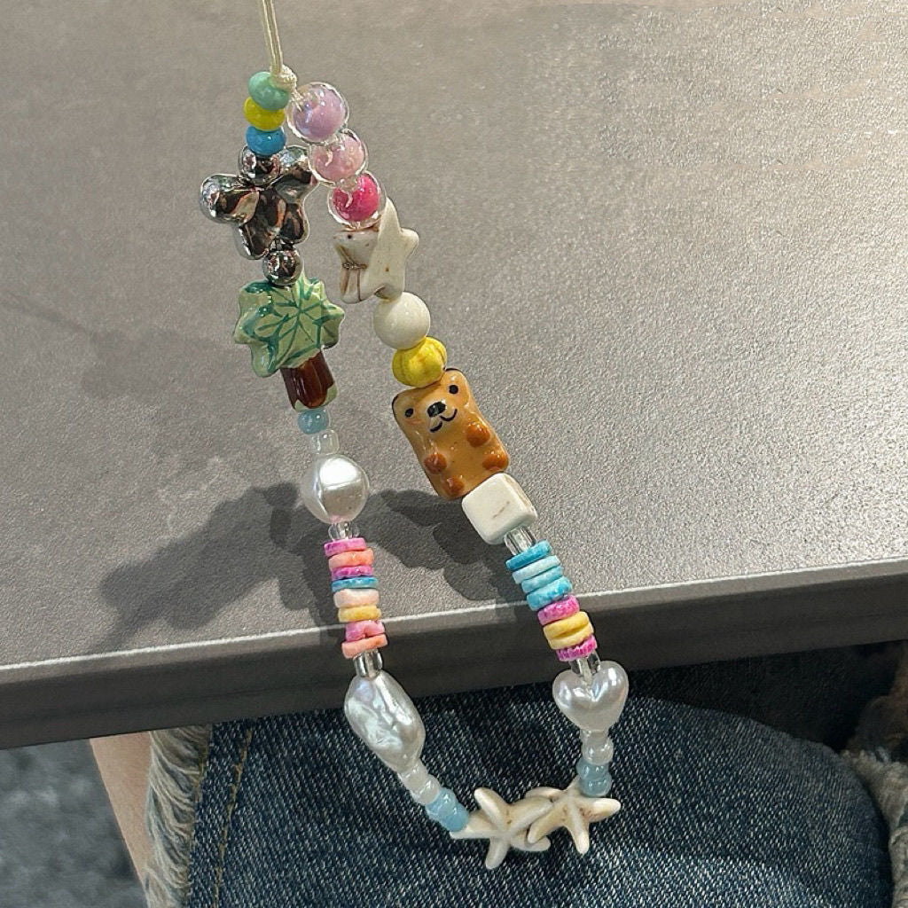 Spielerische thematisierte Perlencharms Eyewear Halskette Brehn