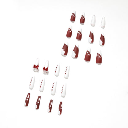 Kunstvolle Stiletto-Nägel mit Schleifen- und Zickzackdesign Brehn