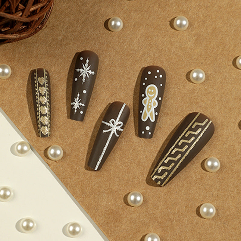 Künstliche Nagelkunst mit festlichem Lebkuchen-Design Brehn