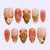 Kunstnagelset mit bunten Blumen- und Glitzerakzenten Brehn
