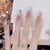 Künstlerisches Stiletto Press-On Nagelset mit Leopardenmuster und Schleifenakzenten Brehn