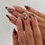 Künstlerisches Press-On-Nagelset mit eleganten Blumen- und abstrakten Designs Brehn