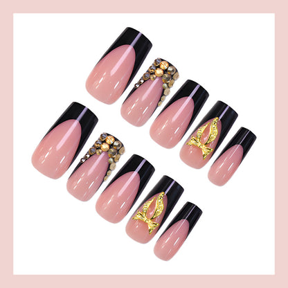 Kunstnagelset mit eleganter Goldverzierung und stilvollem Schwarz Brehn