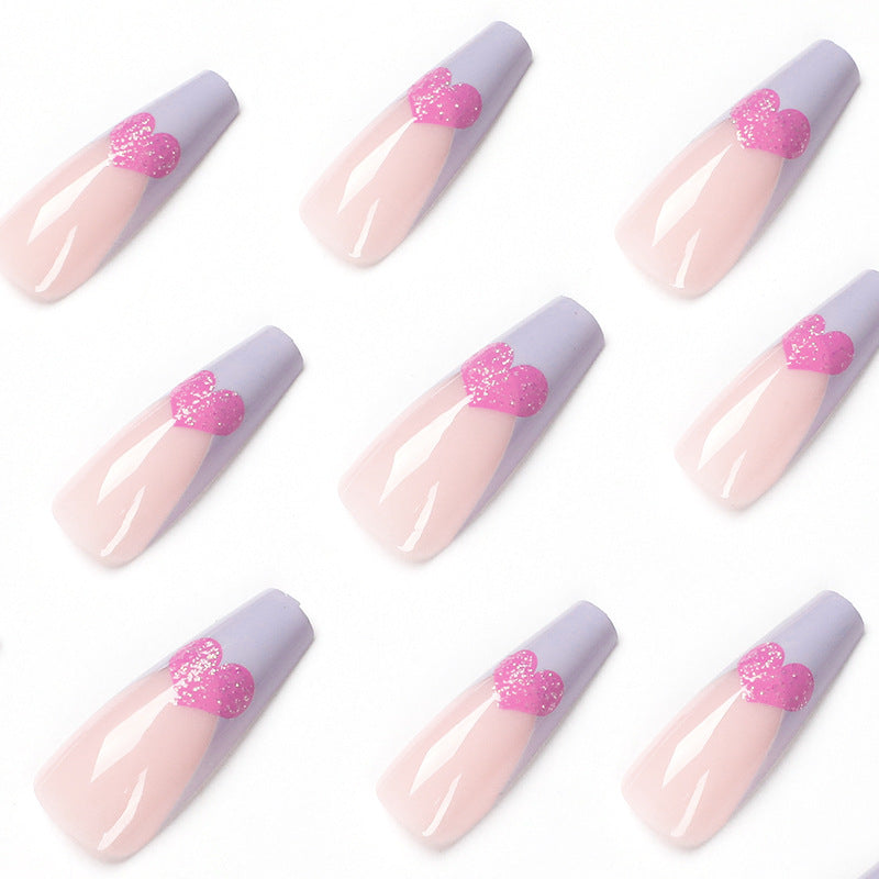 Kunstvolle Stiletto-Nägel mit bunten Herzmotiven Brehn