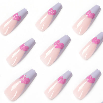 Kunstvolle Stiletto-Nägel mit bunten Herzmotiven Brehn
