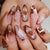 Kreatives Kunstnagelset mit eleganten Blütenakzenten Brehn