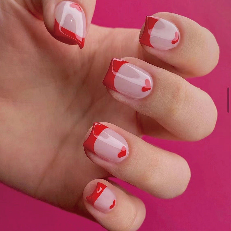 Kunstvolle Nagelverlängerungen mit Herz-Motiv Brehn