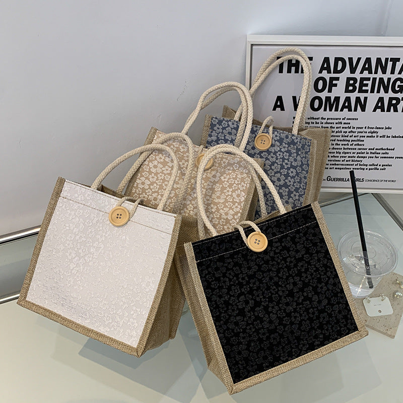 Elegante floral gemusterte Handtasche