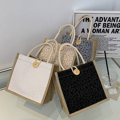Elegante floral gemusterte Handtasche