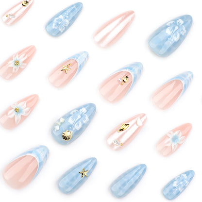 Kunstvolle Nagelverlängerungen mit zarten floralen Designs und Glitzerakzenten Brehn