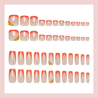 Kunstnagelset mit stilvollen orangen Neon-Akzenten Brehn