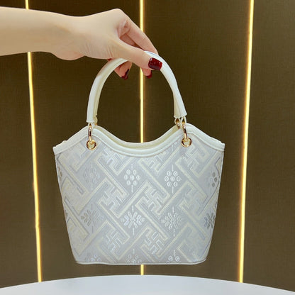 Dekorative gemusterte Handtasche