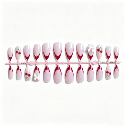 Künstlerisches Kirsch- und Schleifen-Nageldesign