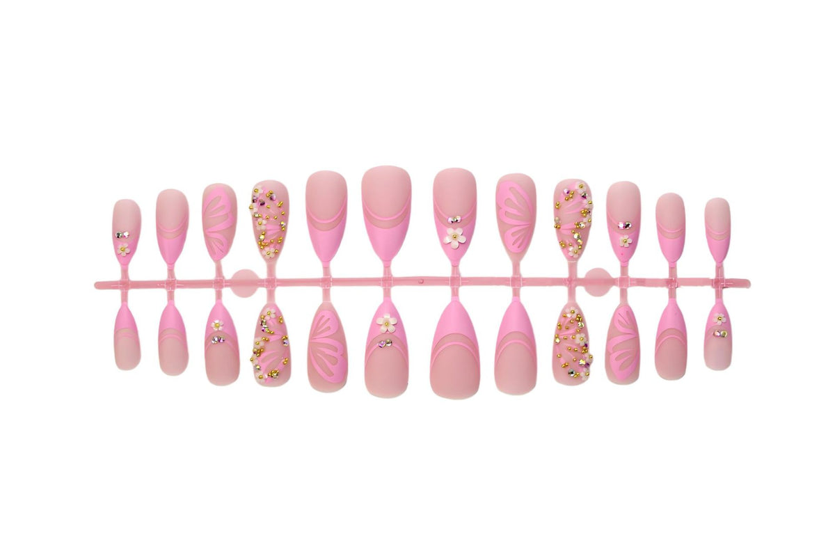 Kunstnagelset mit eleganten Blüten- und Glitzerverzierungen Brehn